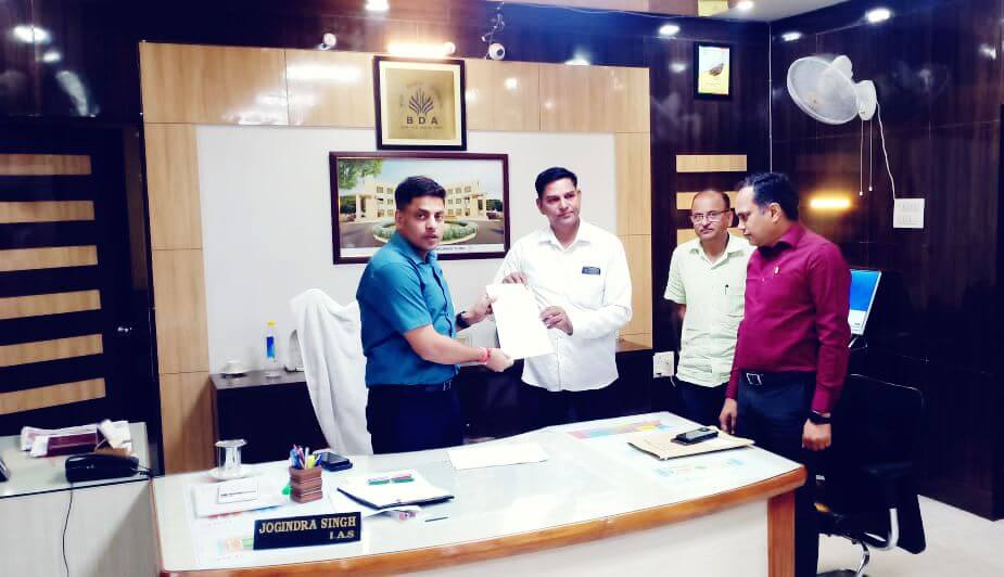 Paper handover by BDA VC Mr. Joginder Singh